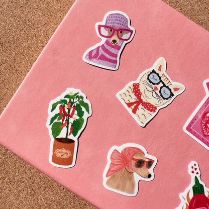Set of stickers featuring animals and plants on a pink surface