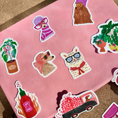 Collection of colorful stickers on a pink fabric background