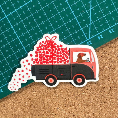 Sticker of a truck with hearts and a dog on a cutting mat