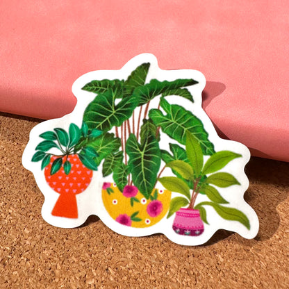 Sticker with illustrations of potted plants on a cork surface with pink fabric in the background