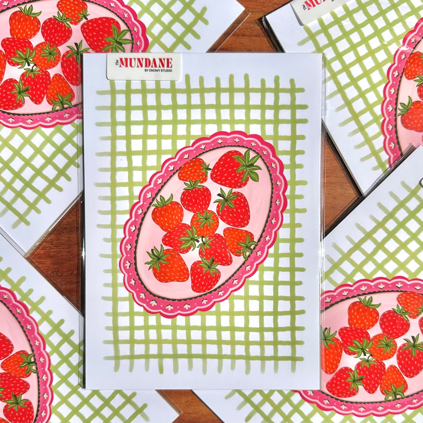 Notebook with strawberry design on a checkered background