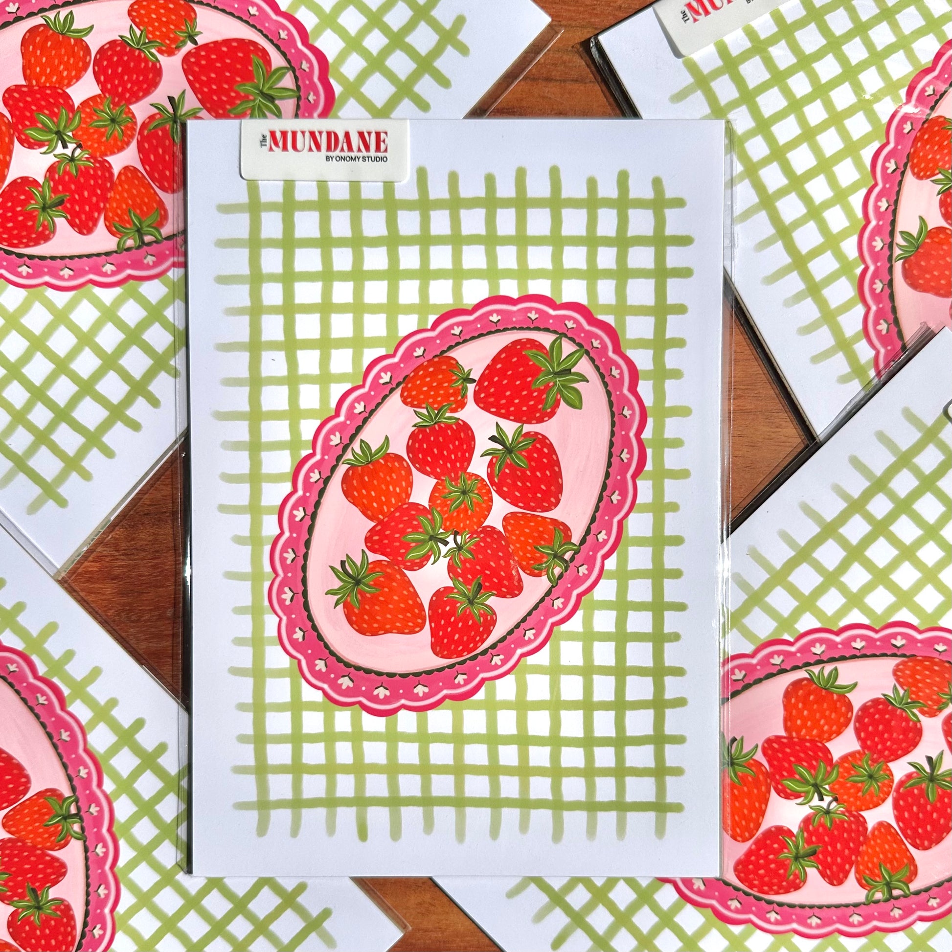 Notebook with strawberry design on a checkered background