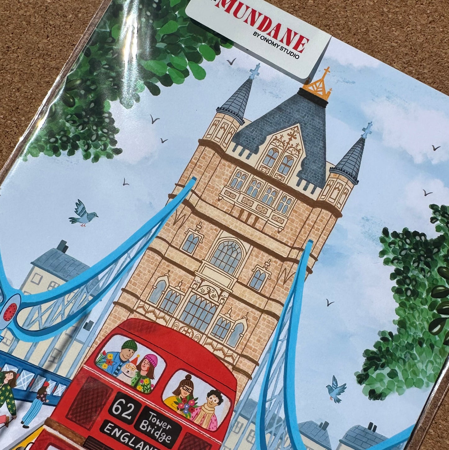Packaged product with a illustrated design of a clock tower and red bus, featuring the brand 'Mundane'.