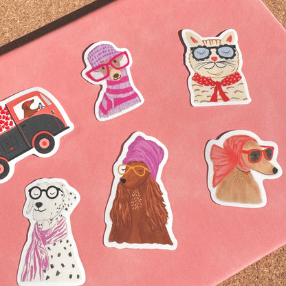 Set of animal-themed stickers with accessories on a pink background