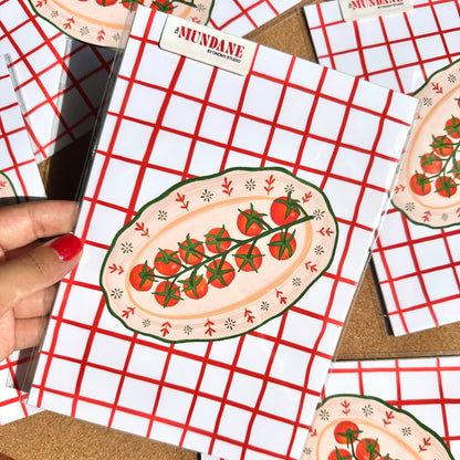 Notebook with tomato design on a red and white checkered background
