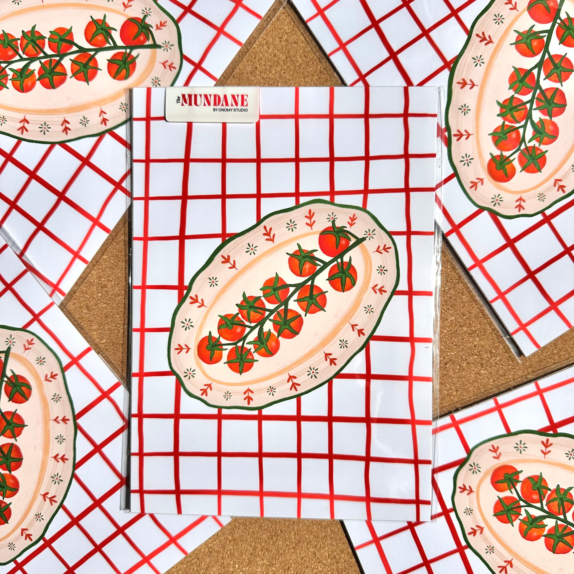 Notebook with tomato design on cover on a red and white checkered background