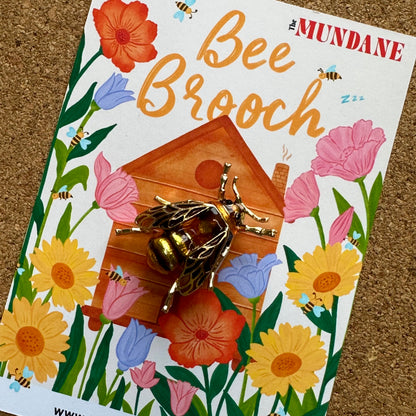 Enamel Gold Bee Brooch / Pin on a wild flower Bee hive Illustration backing card