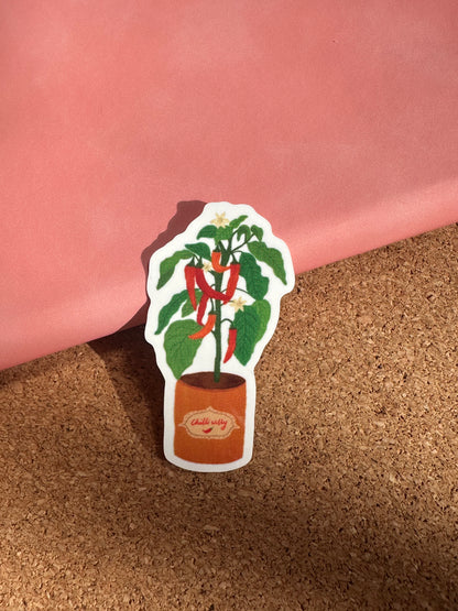 Sticker with a design of a bottle and leaves on a person's arm.