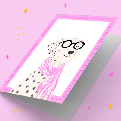 Card with a dalmatian dog wearing glasses on a pink background