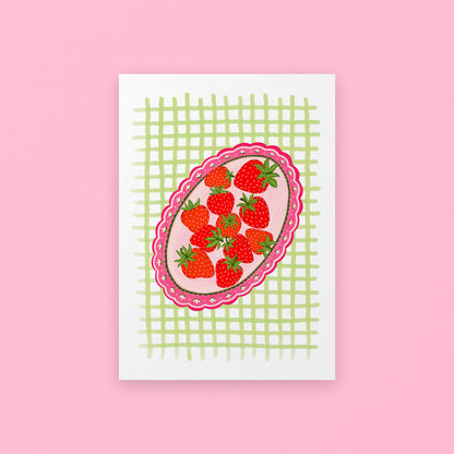 Card with strawberry design on a pink background