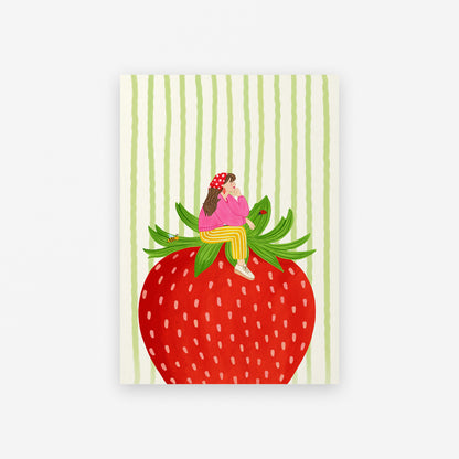 Notebook with a design of a person sitting on a strawberry against a striped background