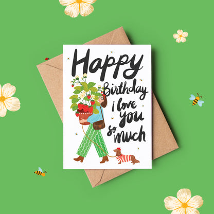 Girl Holding Strawberry Plant with Sausage Dog Greeting Card